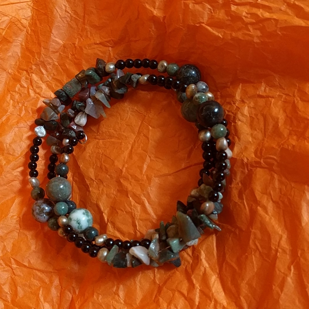 Necklace on stiff wire with beads and stones